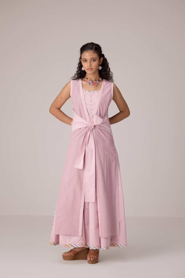 Blush pink panelled dress with contrast striped cord piping paired with a tie-up matching overlay