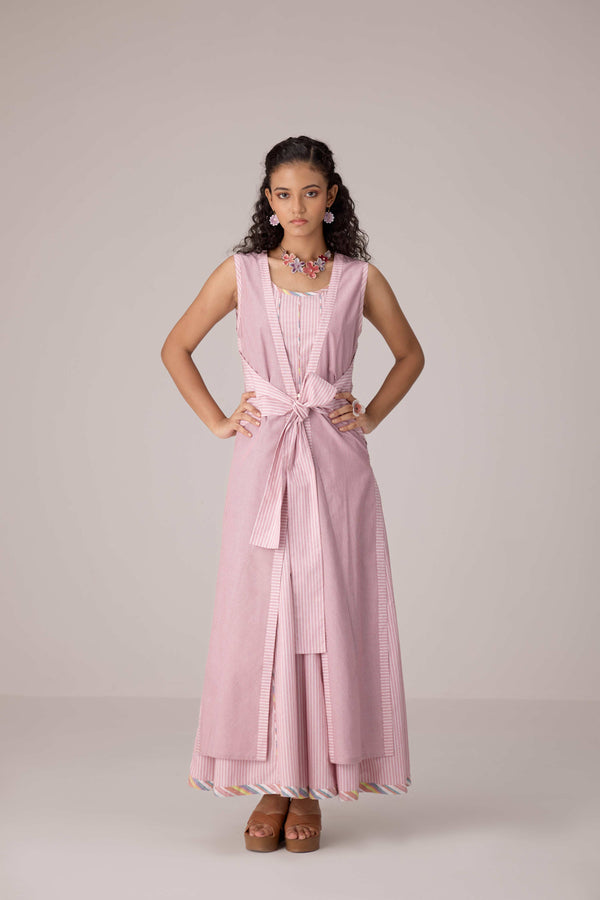 Blush pink panelled dress with contrast striped cord piping paired with a tie-up matching overlay