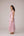Blush pink panelled dress with contrast striped cord piping paired with a tie-up matching overlay