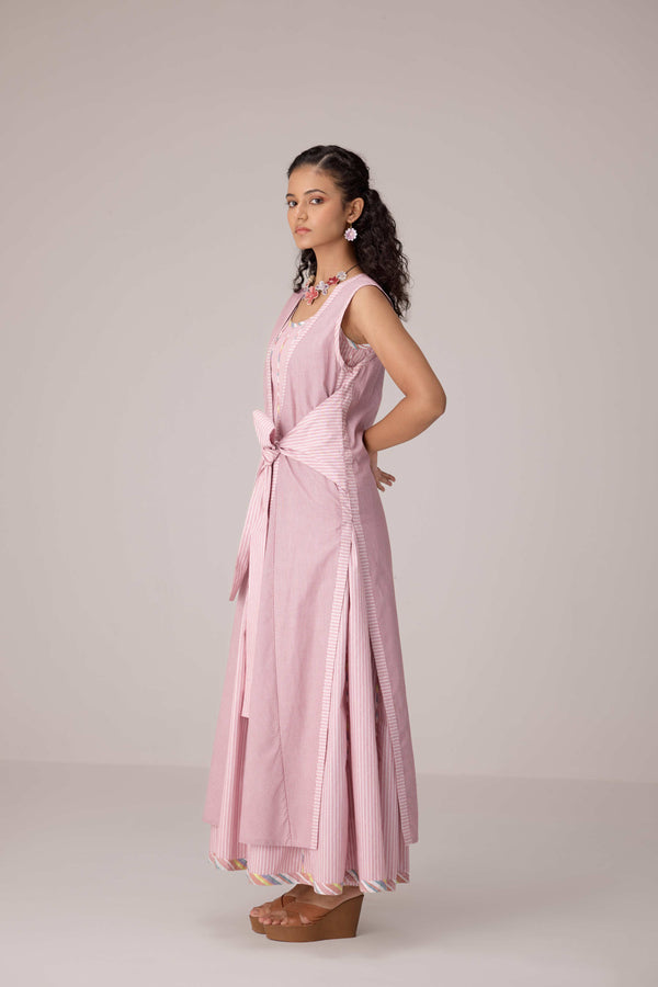 Blush pink panelled dress with contrast striped cord piping paired with a tie-up matching overlay