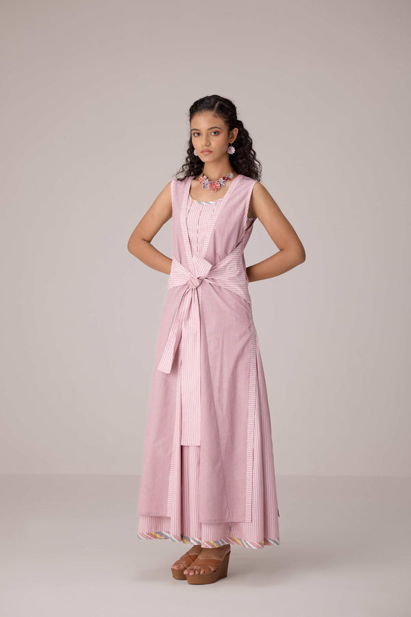 Blush pink panelled dress with contrast striped cord piping paired with a tie-up matching overlay