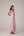 Blush pink panelled dress with contrast striped cord piping paired with a tie-up matching overlay