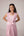 Blush pink panelled dress with contrast striped cord piping paired with a tie-up matching overlay