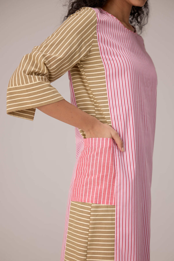 Cotton dress with outer side pockets paired with a tie wrap.