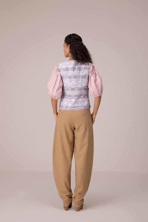 Patchwork waistcoat in pastel checks with striped puff sleeved blouse and high waisted barrel pants in cotton linen