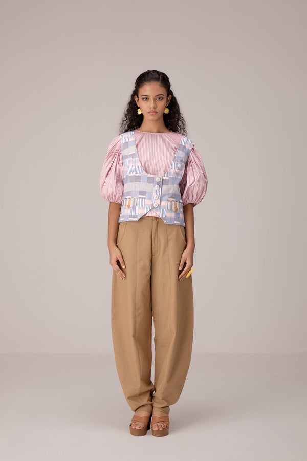 Patchwork waistcoat in pastel checks with striped puff sleeved blouse and high waisted barrel pants in cotton linen