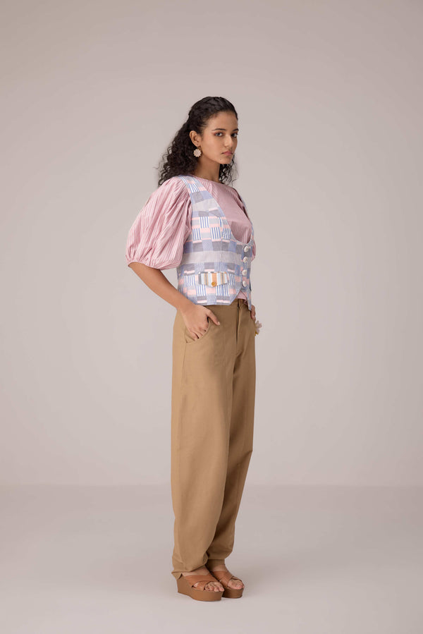 Patchwork waistcoat in pastel checks with striped puff sleeved blouse and high waisted barrel pants in cotton linen