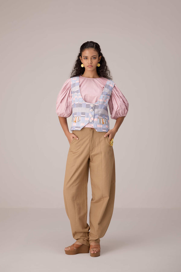 Patchwork waistcoat in pastel checks with striped puff sleeved blouse and high waisted barrel pants in cotton linen