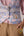 Patchwork waistcoat in pastel checks with striped puff sleeved blouse and high waisted barrel pants in cotton linen