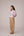 Patchwork waistcoat in pastel checks with striped puff sleeved blouse and high waisted barrel pants in cotton linen