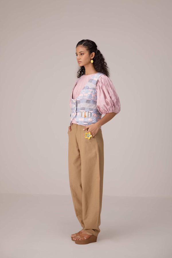 Patchwork waistcoat in pastel checks with striped puff sleeved blouse and high waisted barrel pants in cotton linen