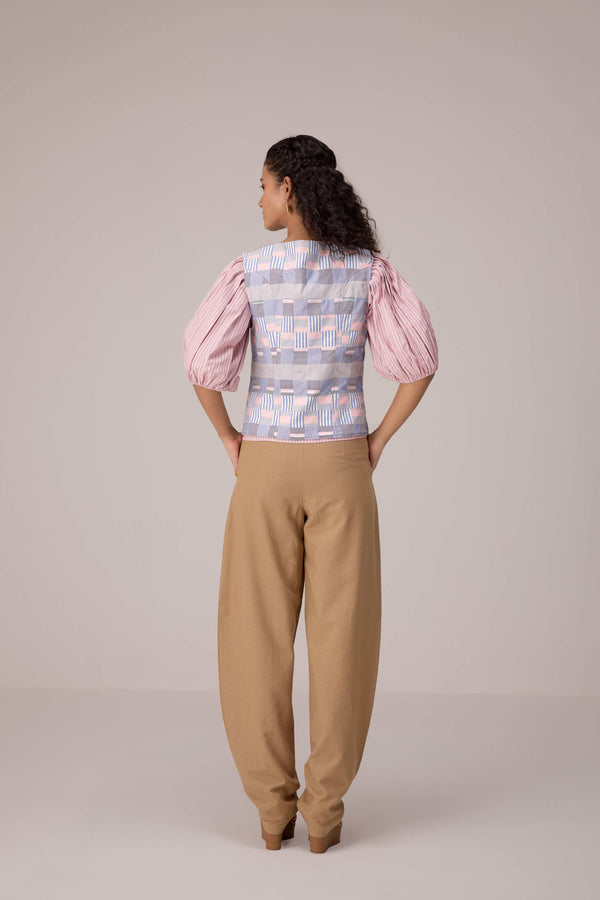 Patchwork waistcoat in pastel checks with striped puff sleeved blouse and high waisted barrel pants in cotton linen