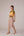 Mustard yellow cropped vest with applique embroidery paired with high waisted knee length pencil skirt in linen fabric