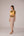 Mustard yellow cropped vest with applique embroidery paired with high waisted knee length pencil skirt in linen fabric