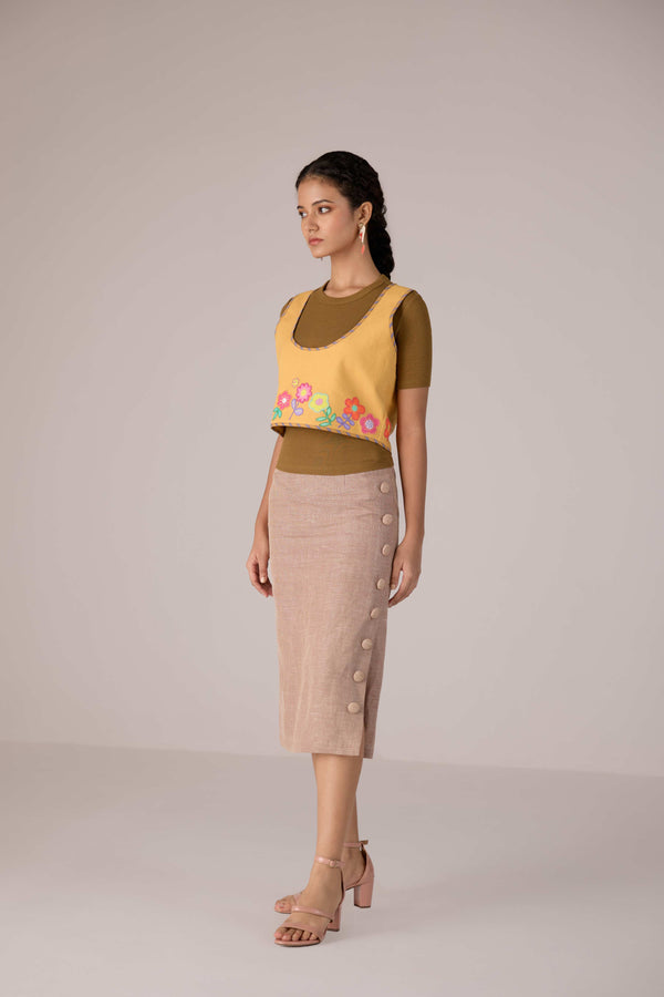 Mustard yellow cropped vest with applique embroidery paired with high waisted knee length pencil skirt in linen fabric