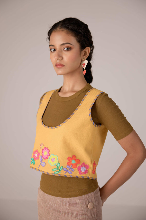 Mustard yellow cropped vest with applique embroidery paired with high waisted knee length pencil skirt in linen fabric