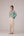 Teal wrapped jacket with barrel trousers