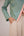 Teal wrapped jacket with barrel trousers