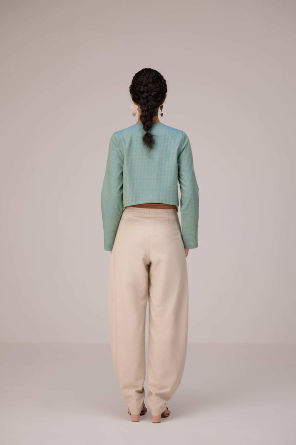 Teal wrapped jacket with barrel trousers