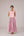 Soft pink sleeveless relaxed fit blouse with pleat details and hand embroidery paired with flared tiered patchwork maxi skirt