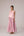Soft pink sleeveless relaxed fit blouse with pleat details and hand embroidery paired with flared tiered patchwork maxi skirt