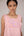 Soft pink sleeveless relaxed fit blouse with pleat details and hand embroidery paired with flared tiered patchwork maxi skirt
