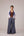 Soft pink sleeveless relaxed fit blouse with pleat details and hand embroidery paired with flared tiered patchwork maxi skirt