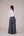Reversable wrapped jacket in cotton linen paired with pleated striped pants in cotton