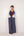 Reversable wrapped jacket in cotton linen paired with pleated striped pants in cotton