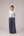 Reversable wrapped jacket in cotton linen paired with pleated striped pants in cotton