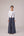 Reversable wrapped jacket in cotton linen paired with pleated striped pants in cotton