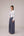 Reversable wrapped jacket in cotton linen paired with pleated striped pants in cotton