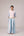 Oversized cotton top with pastel strips paired with wide legged pleated trousers