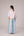 Oversized cotton top with pastel strips paired with wide legged pleated trousers