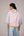 Oversized cotton top with pastel strips paired with wide legged pleated trousers
