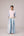 Oversized cotton top with pastel strips paired with wide legged pleated trousers