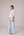 Oversized cotton top with pastel strips paired with wide legged pleated trousers