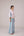 Oversized cotton top with pastel strips paired with wide legged pleated trousers