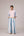 Oversized cotton top with pastel strips paired with wide legged pleated trousers