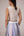 Wrapped jacket with quilted striped corset top paired with cotton polpin skirt