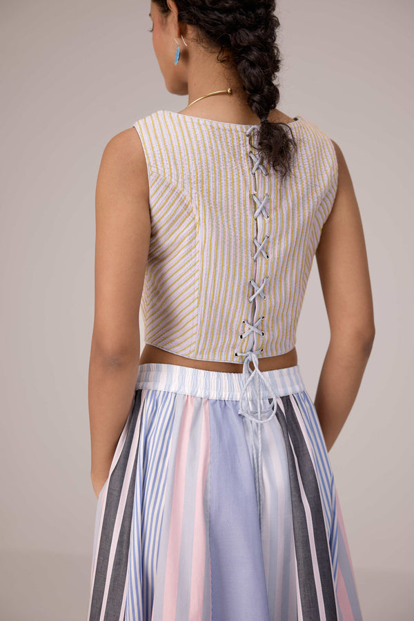 Wrapped jacket with quilted striped corset top paired with cotton polpin skirt