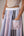 Wrapped jacket with quilted striped corset top paired with cotton polpin skirt