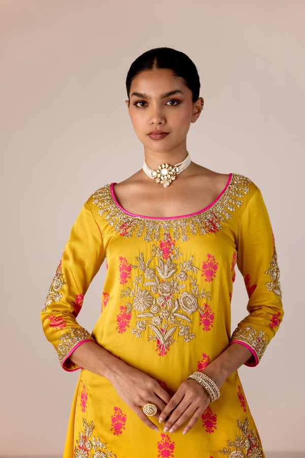 Yellow pink zardozi embroidered top skirt set.