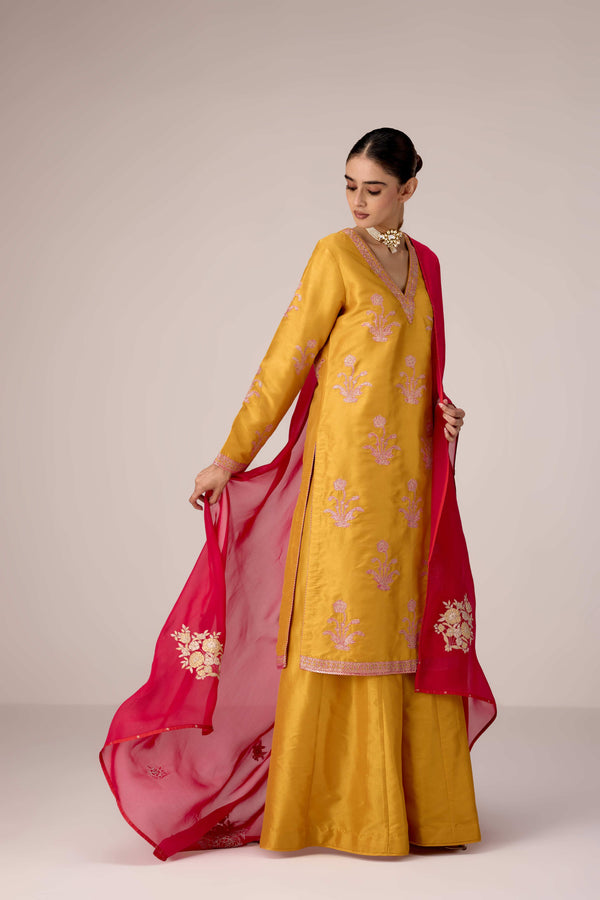 Mustard pink gold patch and thread embroidered kurta pants set.
