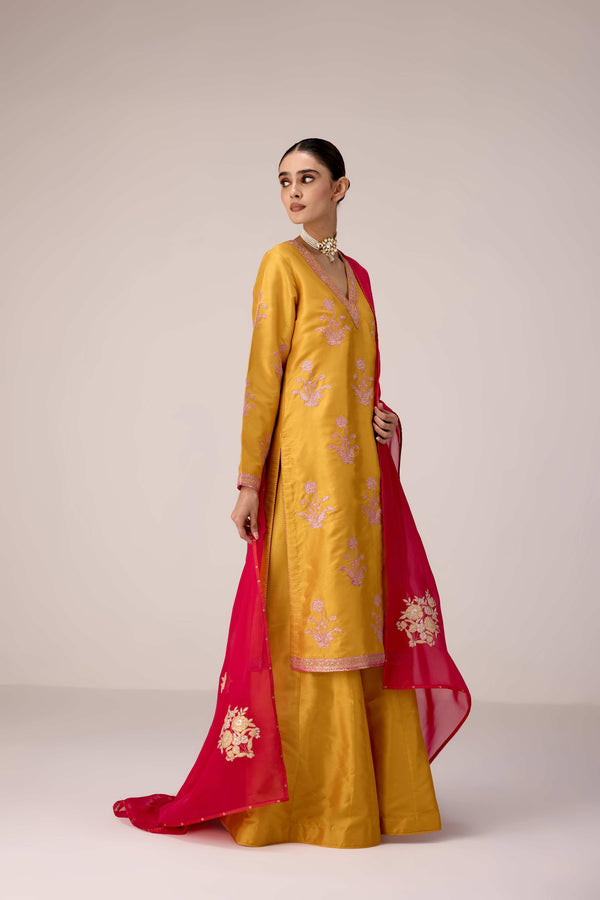Mustard pink gold patch and thread embroidered kurta pants set.