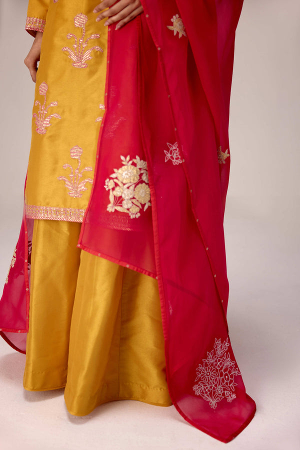 Mustard pink gold patch and thread embroidered kurta pants set.