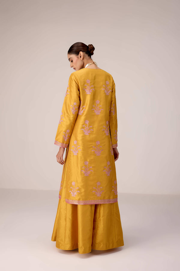 Mustard pink gold patch and thread embroidered kurta pants set.