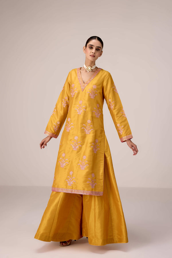 Mustard pink gold patch and thread embroidered kurta pants set.