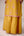 Mustard pink gold patch and thread embroidered kurta pants set.
