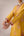 Mustard pink gold patch and thread embroidered kurta pants set.